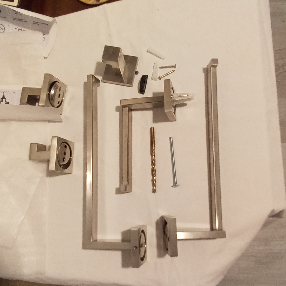 Bathroom Fixtures - 2 Towel Holders, 3 Hooks, and 1 Toilet Paper Holder.